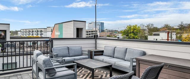Nashville-themed living room with red velvet sofa and bar seating